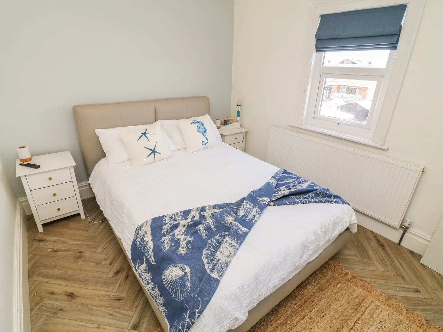 Double bedroom with seahorse and starfish coastal throw