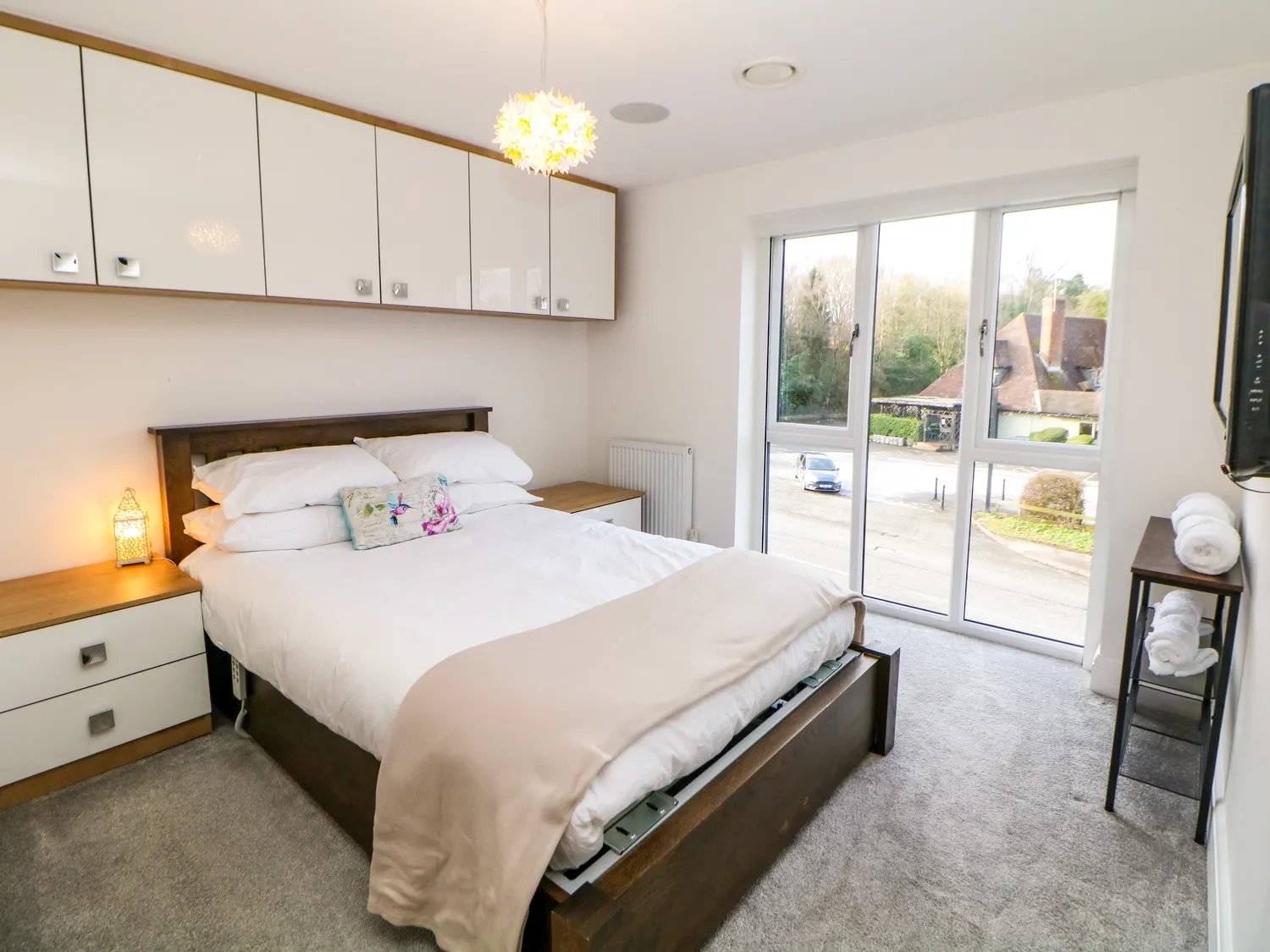 King-size bedroom with fitted wardrobes and large windows