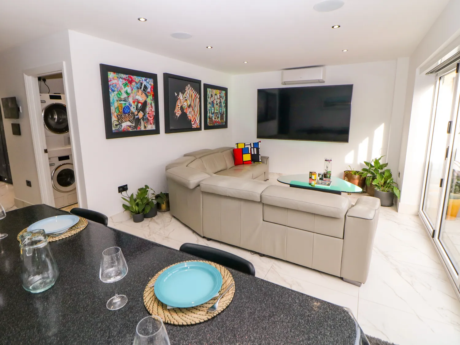 Open-plan living and dining space inside a Stay With Rich property